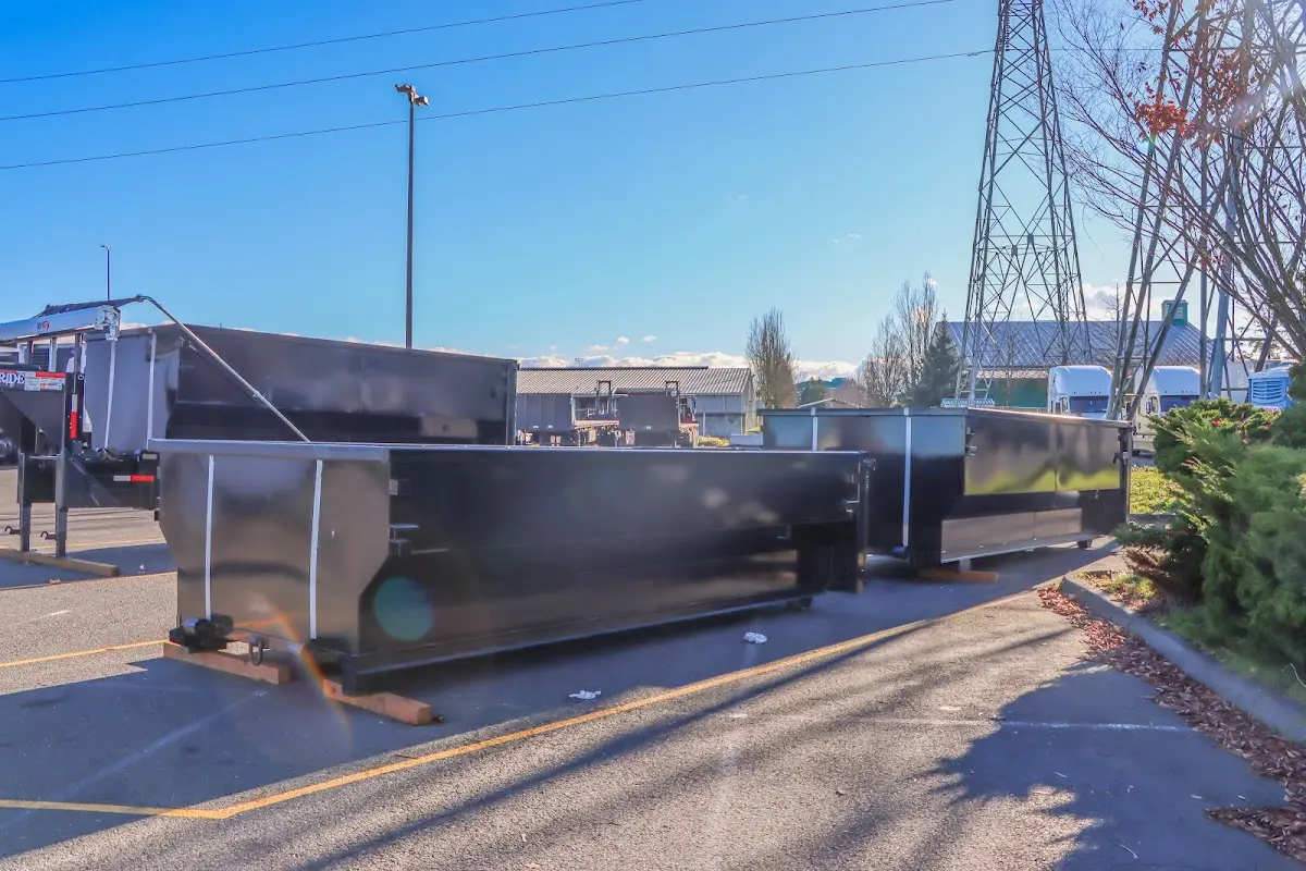 Roll-off dumpster ready for waste disposal at job site for Concrete Dumpster Rental in Deer Park